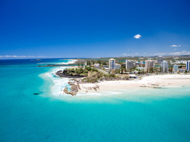 An aerial view looking at the famous Snapper Rocks and Rainbow bay at Coolanagatta on Queensland's Gold Coast