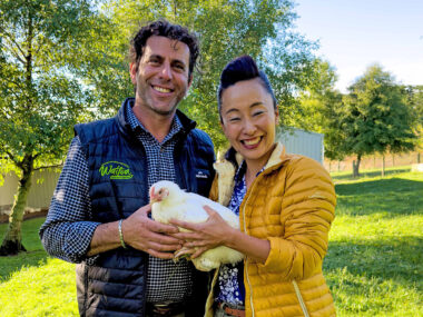Waitoa chicken farmer Ibrahem Break, with Sachie Nomura holding a Waitoa Free Range chicken