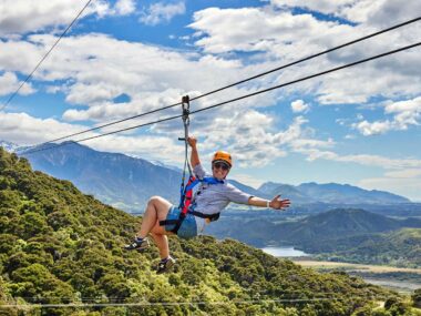 A person ziplining over the town of Kaikōura