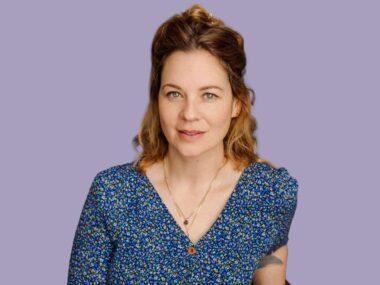 Shoshana McCallum in front of a lilac background