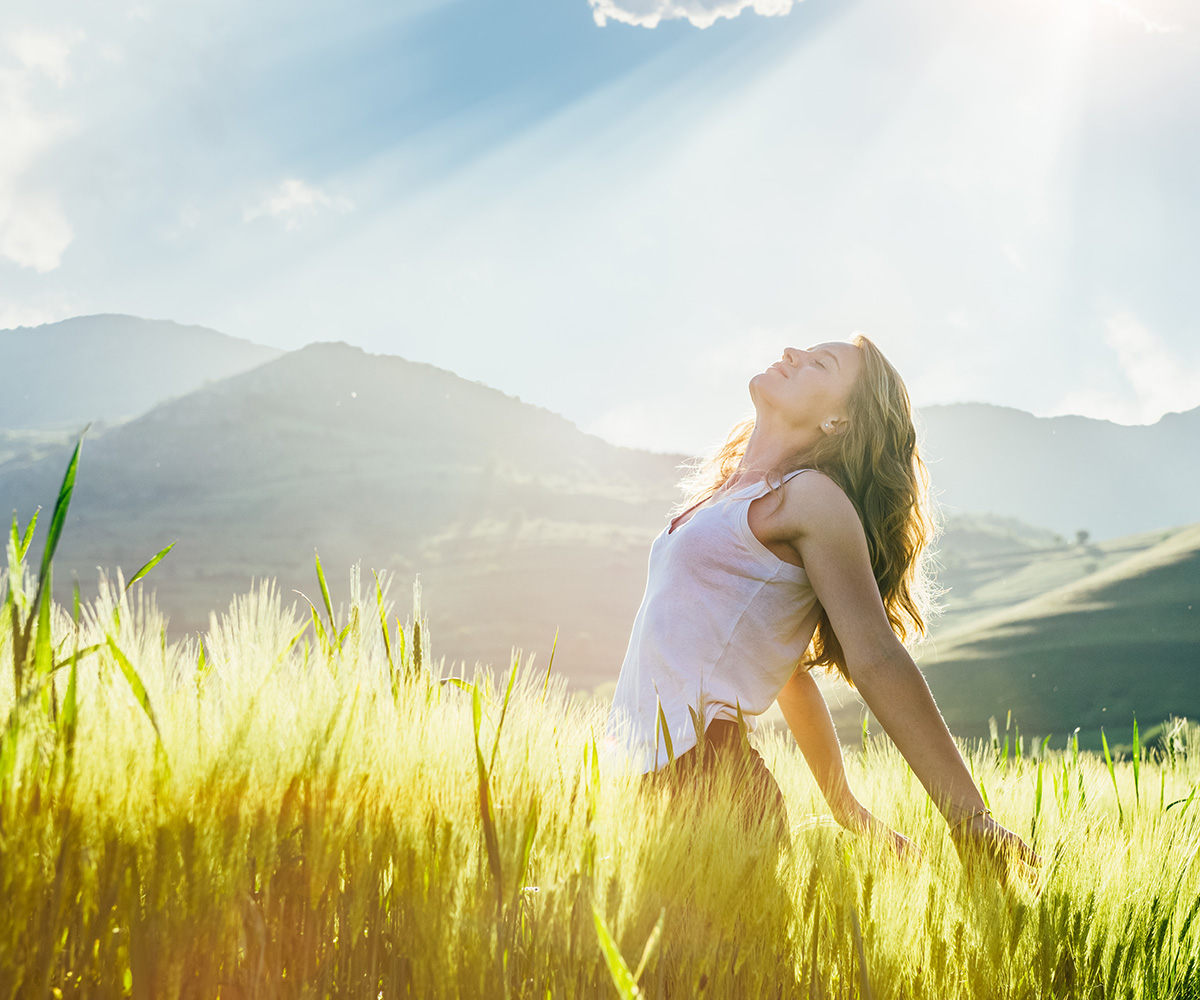 woman basking in sunlight 